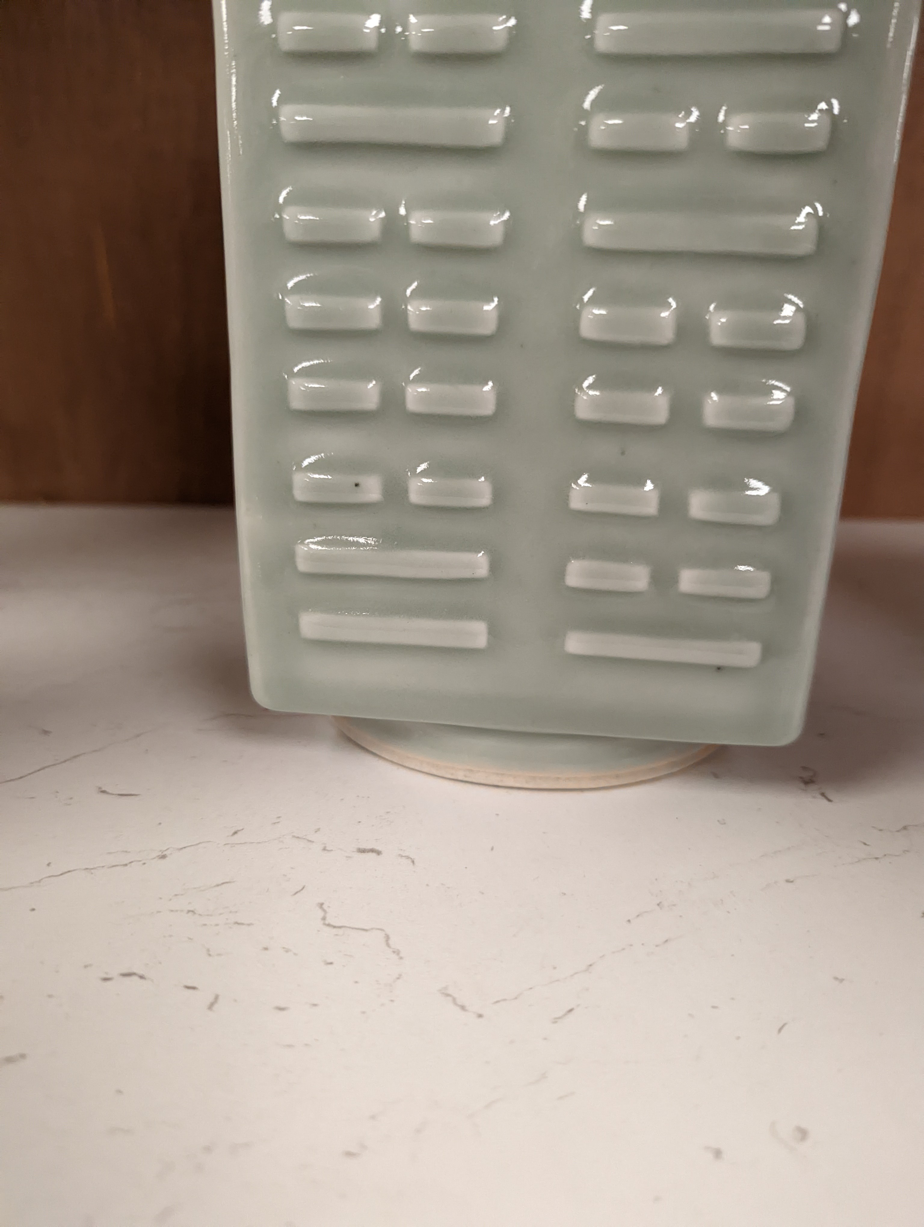 A Chinese celadon glazed eight trigrams cong shaped vase, Guangxu mark and possibly of the period. Provenance - owner bought in auction 20 years ago. 25cm tall